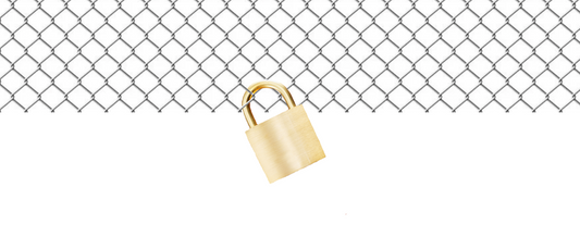 Chain link fence wire fabric with gold padlock attached